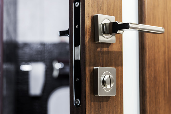 door handle and latch of brass on veneer doors